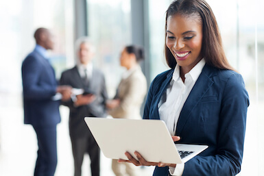 Learn more about our E-Banking tools Image of black business woman with laptop