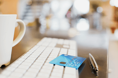 Image of coffee and credit card