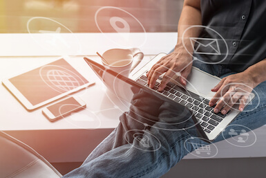 Learn more about Peoples Bank card controls for your debit card Image of man with laptop