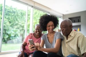 Image of woman and parents on phone