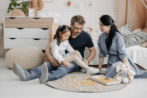 Image of family on floor playing